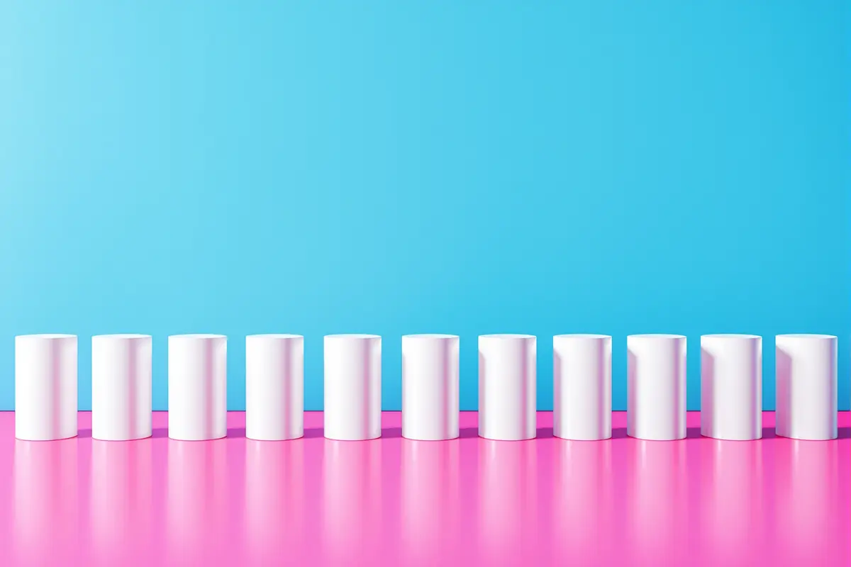 An even row of identical white cylinders, all the same height, none standing out